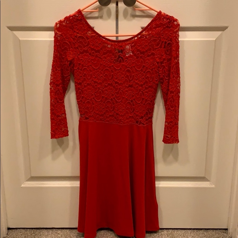Red midi dress with 3/4 sleeves.